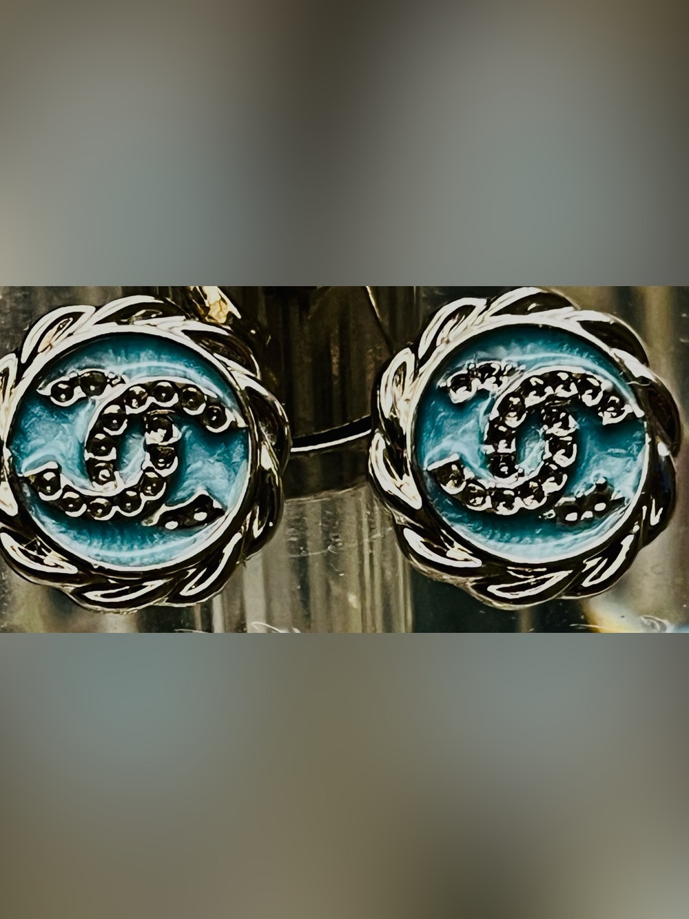 Beautiful sky blue logo earrings with silver tone backing. Pristine